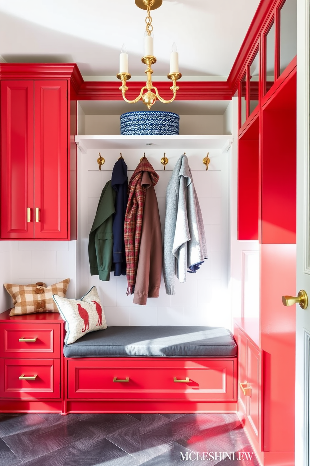 A stylish mudroom featuring vibrant red cabinetry with elegant gold hardware. The space includes built-in benches and hooks for coats, creating a functional yet inviting atmosphere.