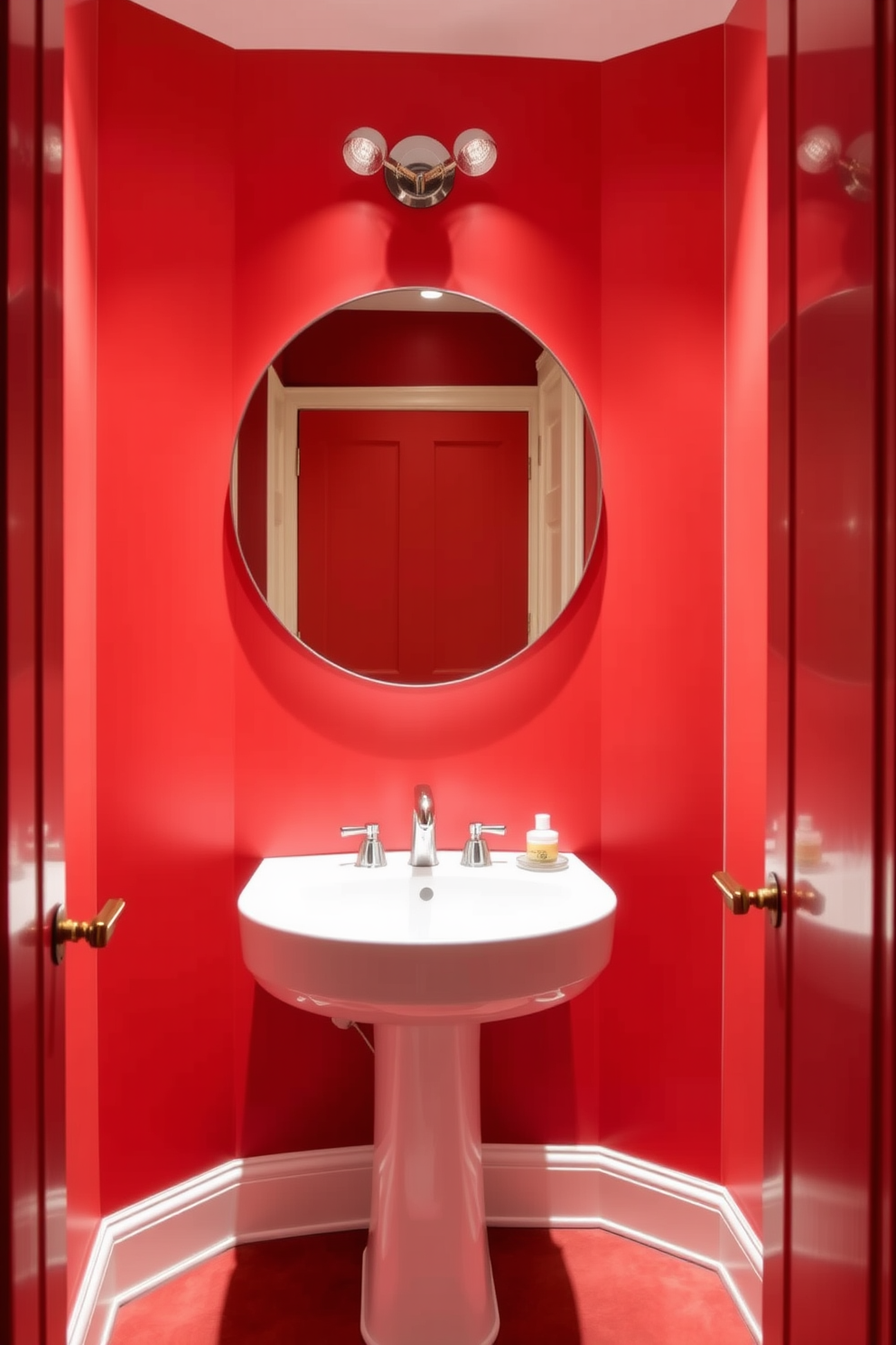 A striking red accent wall creates a bold focal point in the powder room. Soft lighting fixtures strategically placed enhance the warmth and intimacy of the space. The room features a sleek pedestal sink with a modern chrome faucet. Complementing the vibrant wall, a large round mirror reflects the inviting ambiance.