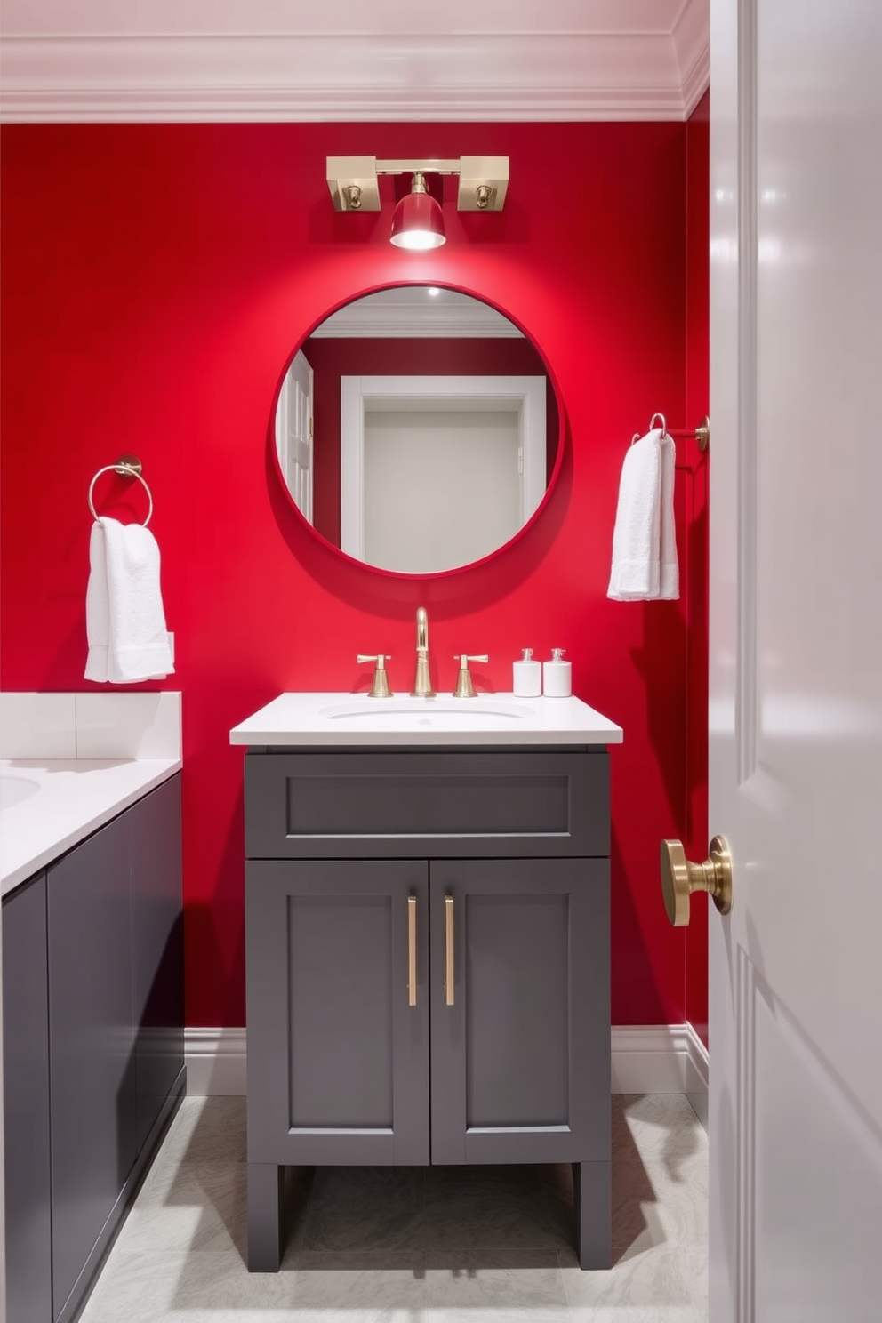 A stylish red and gray powder room features a bold red accent wall that creates a dramatic focal point. The gray vanity boasts sleek lines and is topped with a polished white countertop, providing a modern contrast. Elegant fixtures in brushed nickel add a touch of sophistication to the space. A round mirror with a thin red frame hangs above the vanity, reflecting the vibrant colors and enhancing the room's depth.