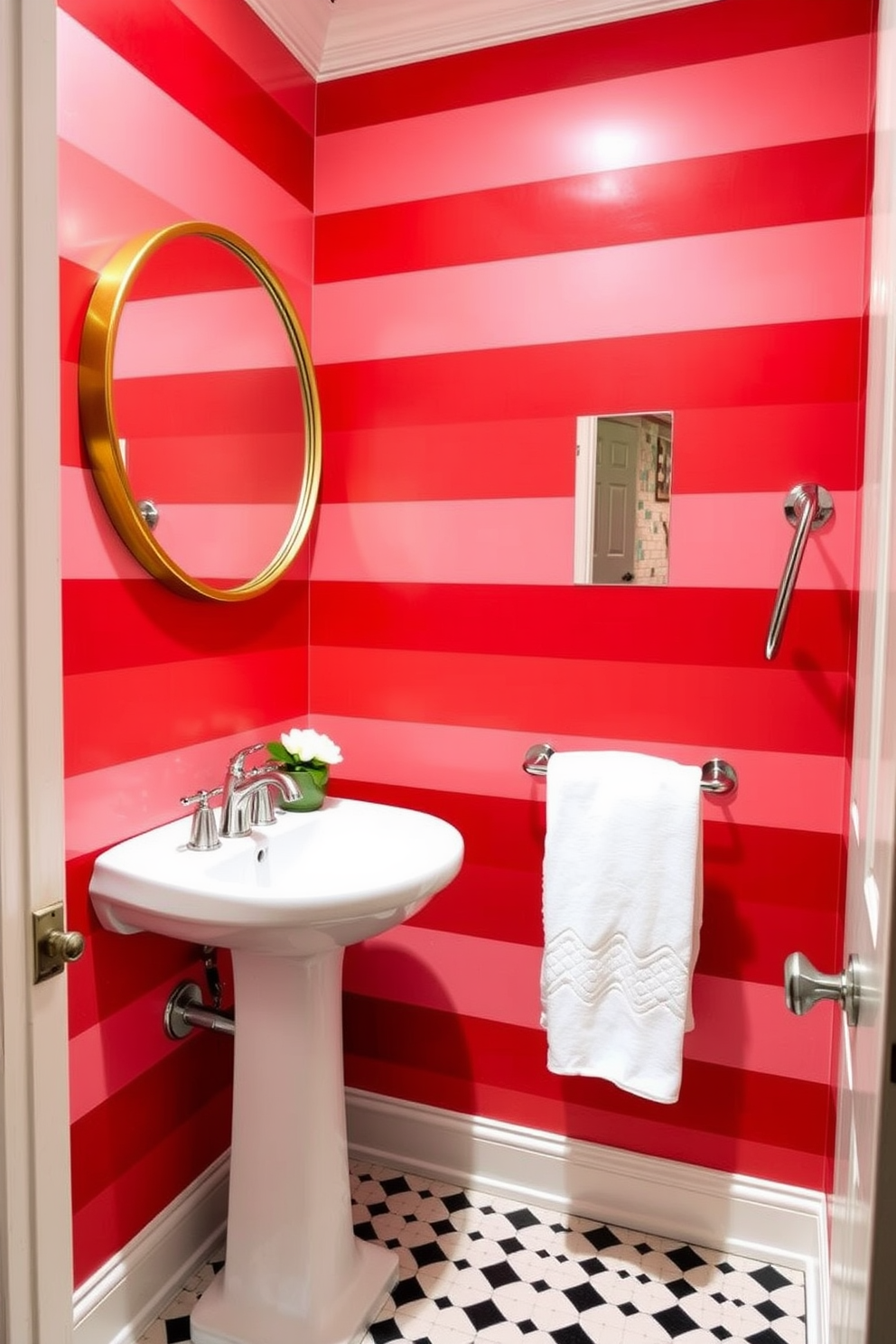 A chic powder room featuring red and white striped wallpaper that creates a bold and inviting atmosphere. The space includes a sleek white pedestal sink and a stylish round mirror with a gold frame, complemented by brushed nickel fixtures. The floor is adorned with classic black and white tiles, enhancing the overall elegance of the room. Decorative accents include a small potted plant on the sink and a plush white towel neatly hung on a chrome rack.