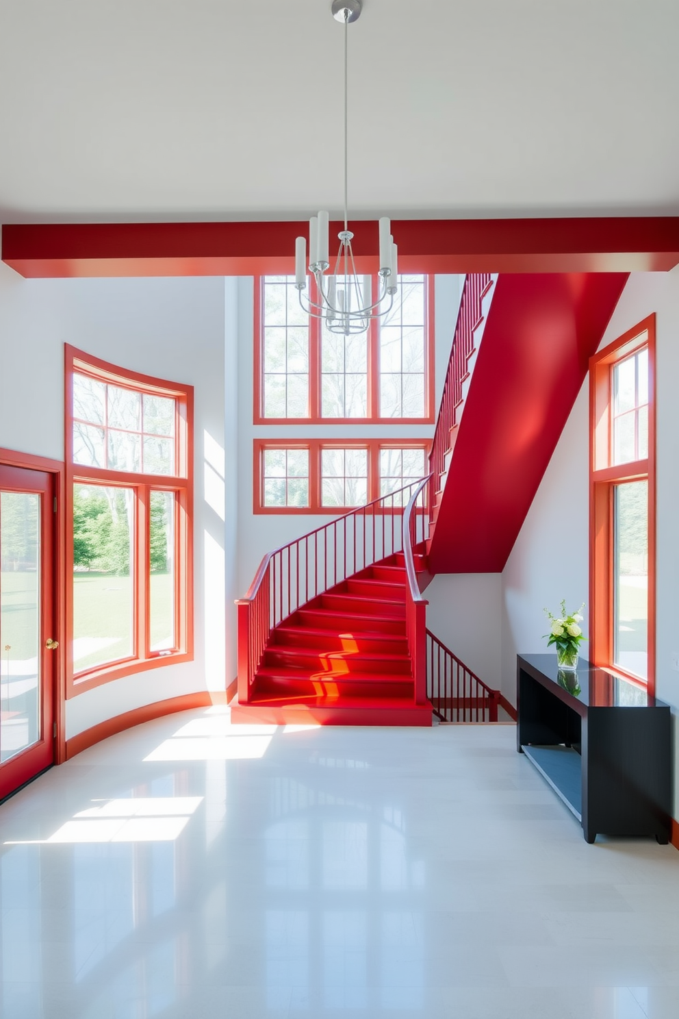 Bright red staircase in airy foyer. The staircase features sleek wooden steps with a glossy finish, contrasting beautifully against the white walls. Large windows allow natural light to flood the space, highlighting the vibrant color of the staircase. A modern chandelier hangs from the ceiling, adding elegance to the open area.