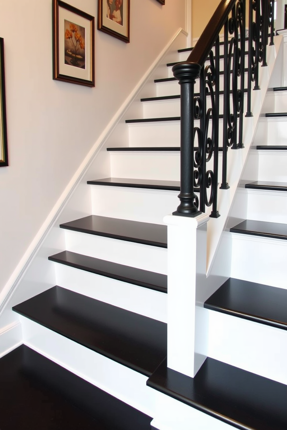 Classic white stairs with dark treads create a striking contrast that enhances the elegance of the space. The banister features intricate wrought iron details that add a touch of sophistication to the overall design. The walls adjacent to the staircase are adorned with framed artwork that complements the color scheme. Soft, ambient lighting illuminates the stairs, highlighting the textures of the dark treads and the crisp white risers.