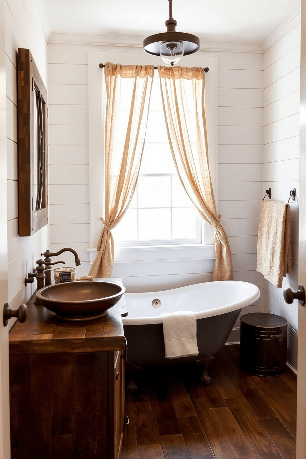 A rustic bathroom adorned with warm metal finishes creates an inviting atmosphere. The space features a reclaimed wood vanity topped with a hammered copper sink, complemented by bronze fixtures. The walls are clad in shiplap painted in a soft white hue, enhancing the rustic feel. A vintage-style clawfoot tub sits under a window, framed by sheer linen curtains that allow natural light to filter in.