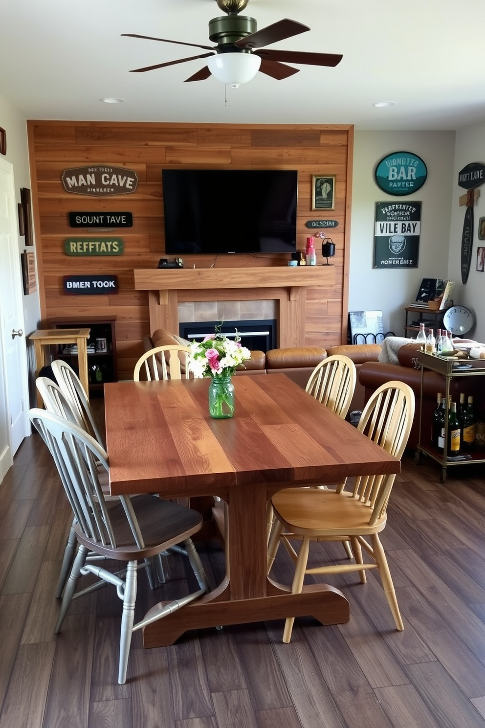 A farmhouse-style dining table made of reclaimed wood is surrounded by mismatched chairs that add character to the space. The table is set with a simple white tablecloth and a centerpiece of fresh flowers in a mason jar. The man cave features a cozy leather sofa positioned in front of a large flat-screen TV mounted on a rustic wooden wall. Vintage signs and sports memorabilia decorate the walls, while a bar cart stocked with drinks sits in the corner, inviting relaxation and entertainment.