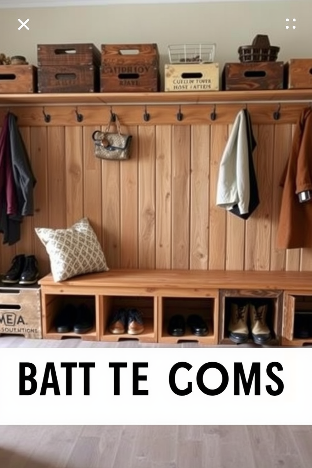 A rustic mudroom features a combination of wooden benches and open shelving for storage. The walls are painted in soft beige, complemented by natural wood accents and a durable stone floor. Cozy hooks line the walls for hanging jackets and bags, while a woven basket sits in the corner for shoes. Large windows allow natural light to flood the space, enhancing the warm and inviting atmosphere.