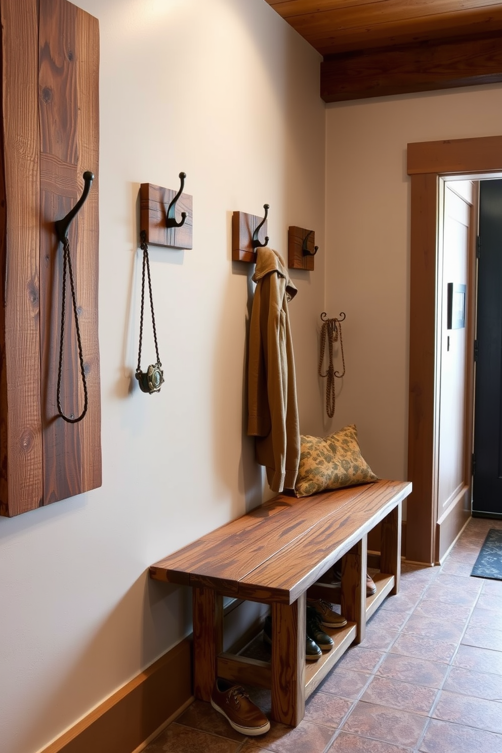 A barn door entrance adds a unique charm to the rustic mudroom. The space features reclaimed wood accents, a shiplap wall, and a bench with storage underneath for shoes and outdoor gear. Natural light floods the room through a large window, illuminating the earthy color palette of browns and greens. Hooks for coats and bags line the walls, and a woven basket sits in the corner for additional organization.