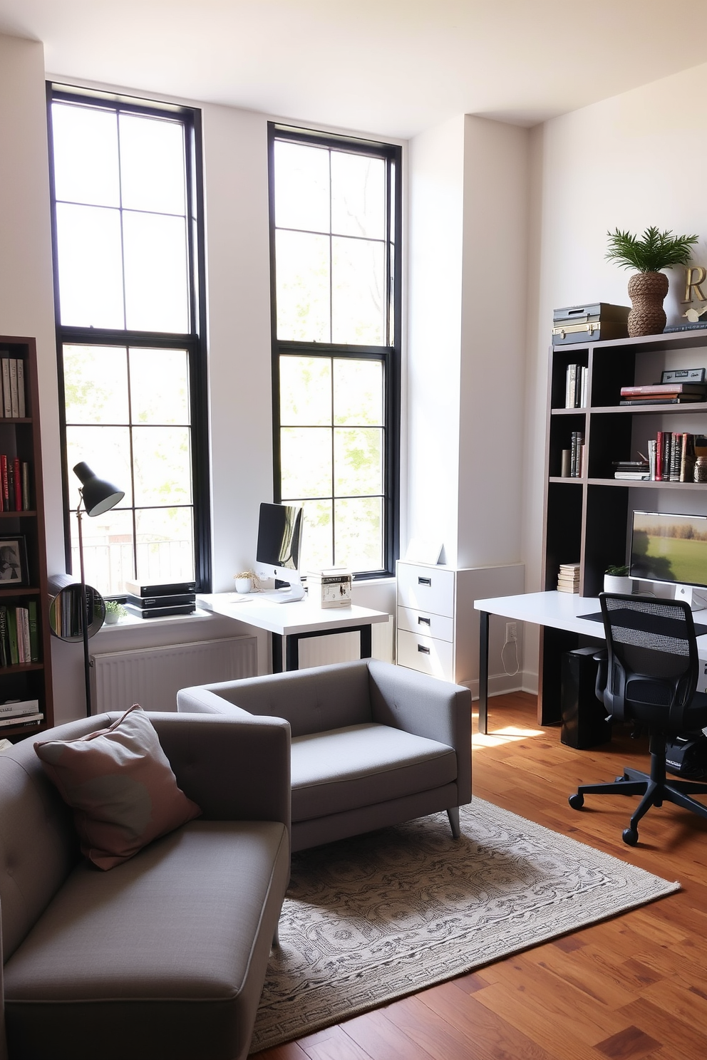 A cozy shared home office featuring a small, stylish sofa in a soft gray fabric, positioned near a large window that lets in plenty of natural light. The workspace includes two modern desks, each with ergonomic chairs, surrounded by shelves filled with books and decorative items.