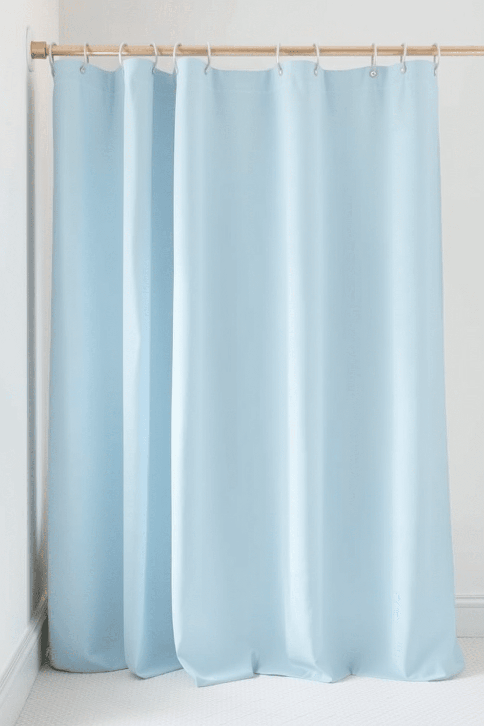 A minimalist shower curtain design featuring solid colors in soft pastels creates a sleek and elegant look. The curtain flows gracefully to the floor, enhancing the simplicity and tranquility of the bathroom space. Incorporating a subtle texture into the fabric adds depth while maintaining a clean aesthetic. The choice of colors such as pale blue or soft beige complements the overall minimalist theme beautifully.