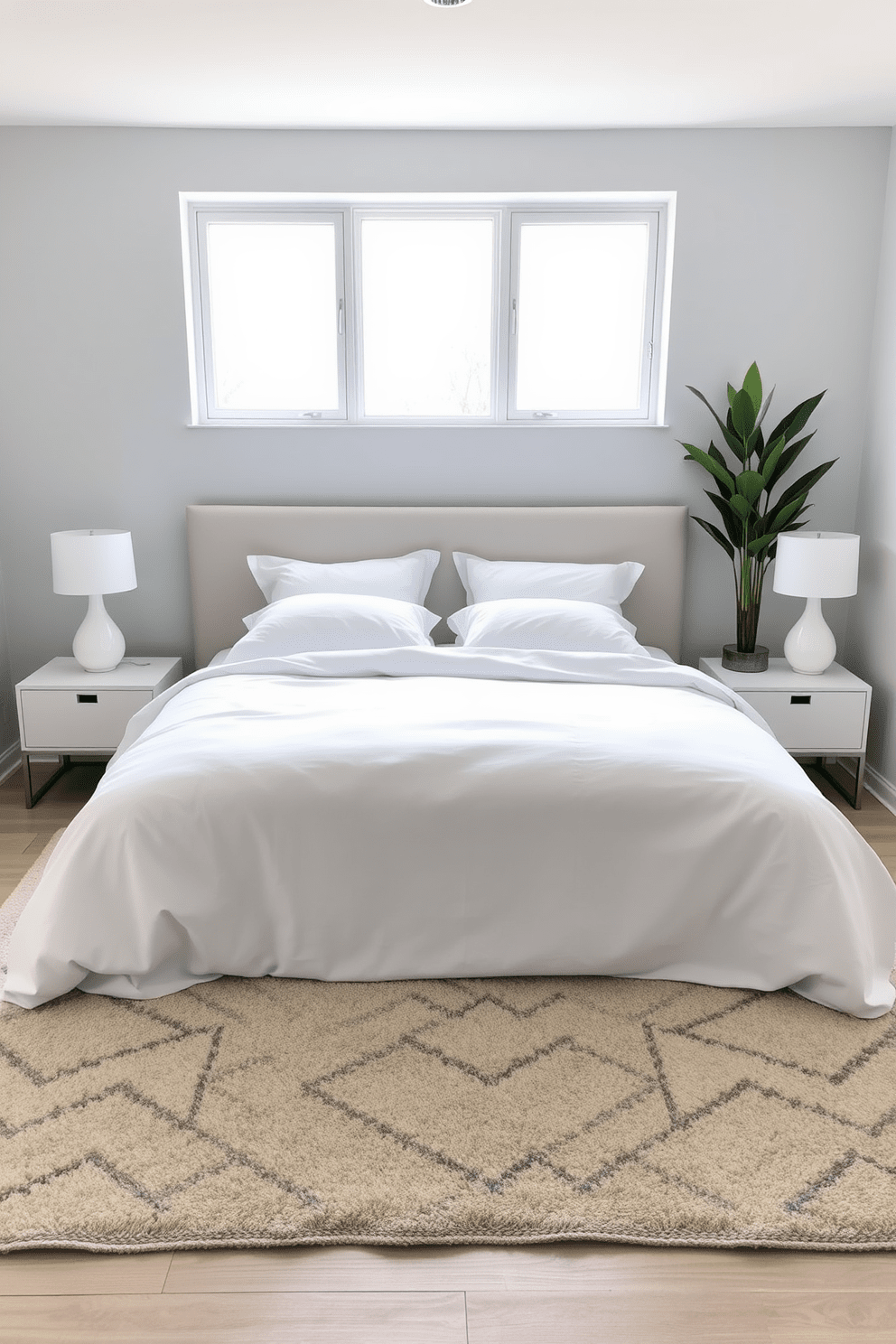 A serene bedroom setting featuring a plush bed dressed in soft white linens. Flanking the bed are two minimalist nightstands with sleek lamps, and a large window allows natural light to fill the space. In one corner, a tall indoor plant adds a touch of greenery and freshness to the room. The walls are painted in a calming light gray, and a cozy area rug anchors the space beneath the bed.