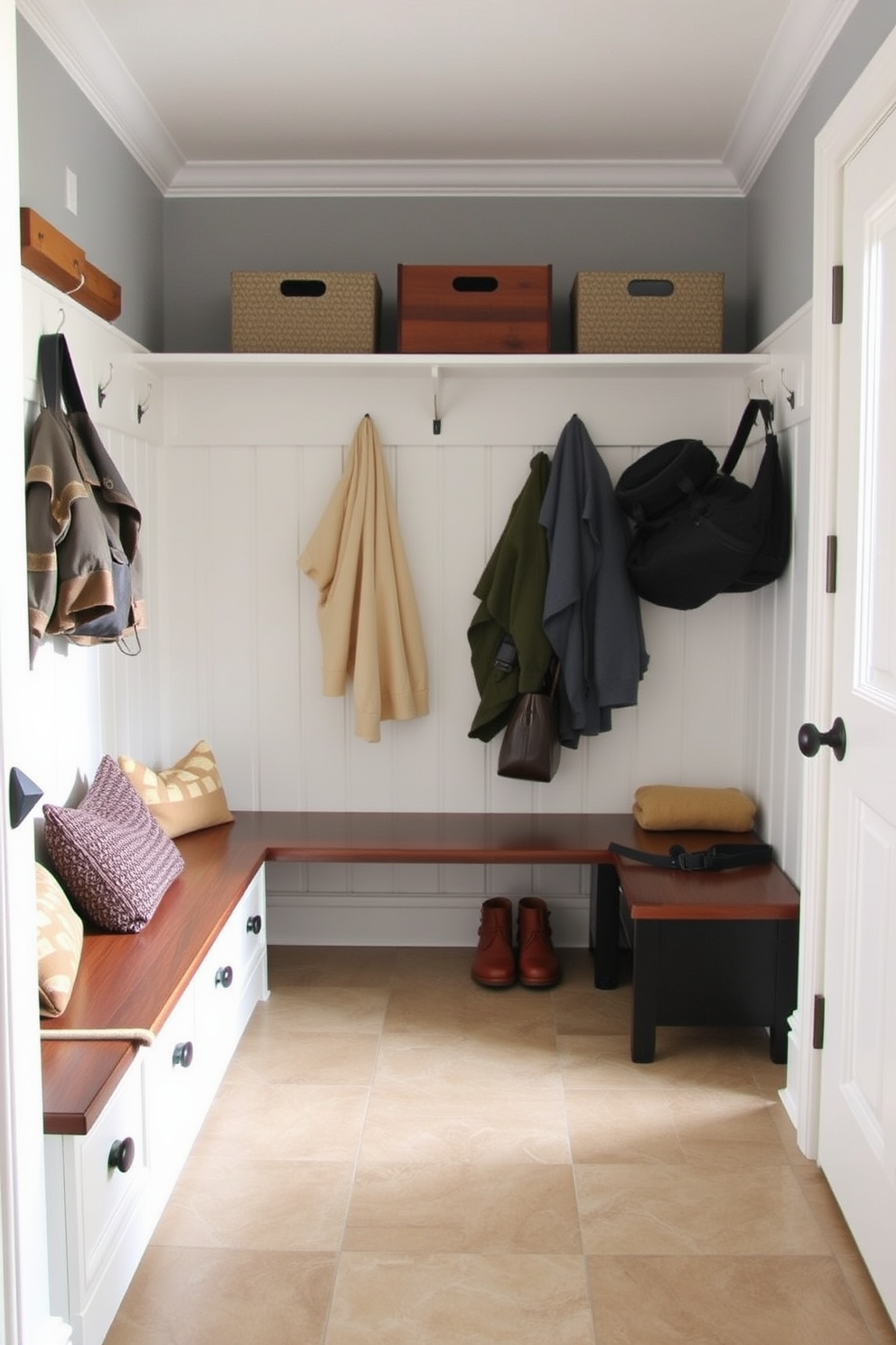 A functional mudroom features durable tile flooring that is easy to clean and maintain. The space includes built-in storage solutions such as benches and hooks for coats and bags.