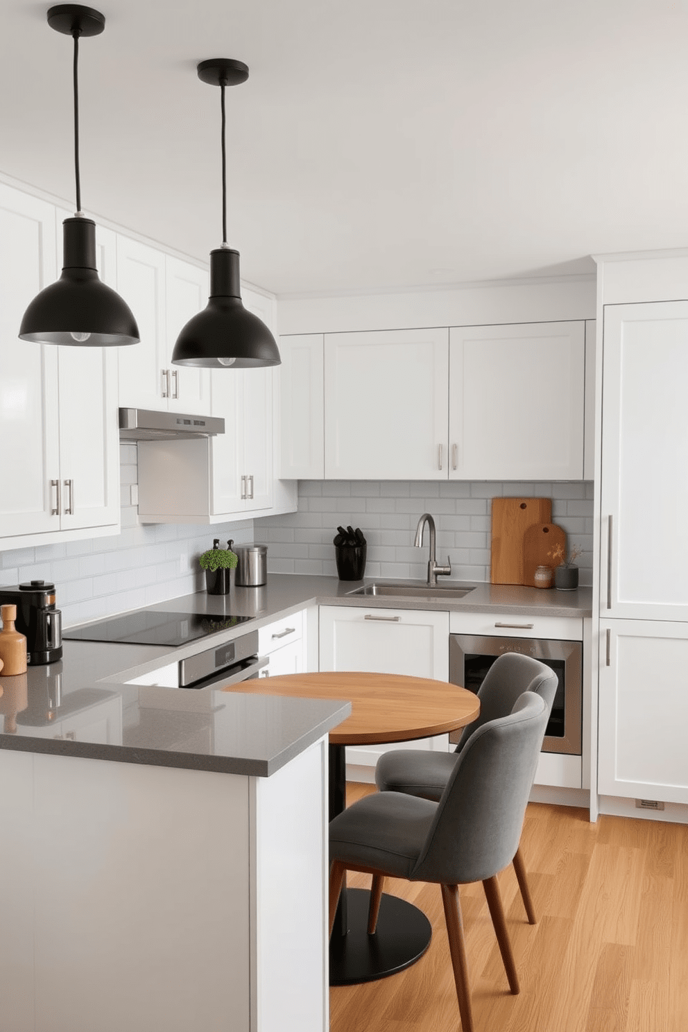 A modern small apartment kitchen featuring a sleek white cabinetry with brushed nickel handles. The countertops are a warm gray quartz, complemented by a stylish backsplash of white subway tiles. The space is illuminated by pendant lights with a matte black finish hanging above a compact island. A cozy dining nook with a round wooden table and upholstered chairs adds a welcoming touch to the design.