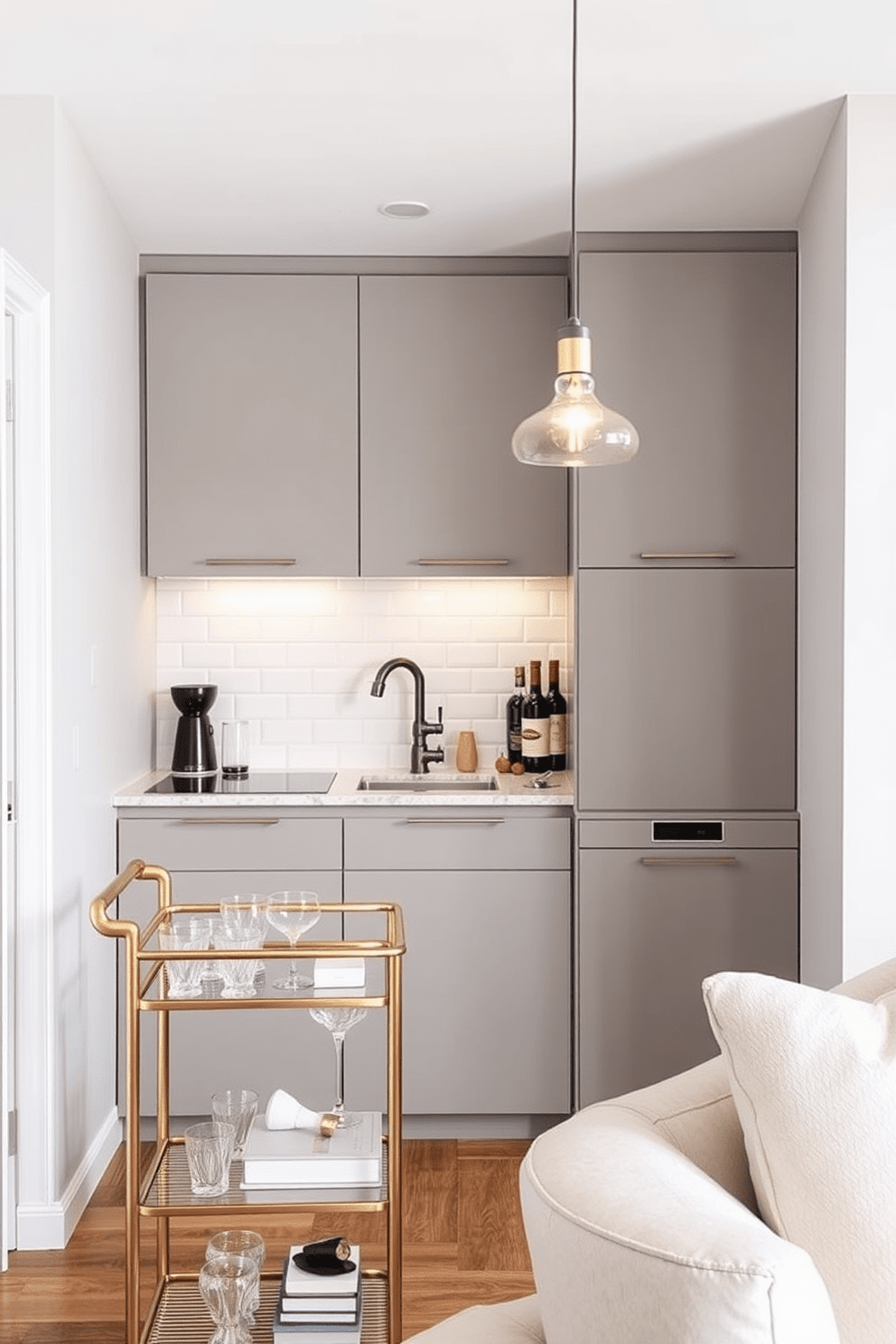 A cozy small apartment kitchen featuring a stylish bar cart for entertaining. The kitchen boasts sleek cabinetry in a soft gray tone, complemented by a white subway tile backsplash and a polished quartz countertop. The bar cart is positioned against the wall, showcasing a selection of glassware and a few decorative elements. Warm pendant lights hang above the island, creating an inviting atmosphere for gatherings.