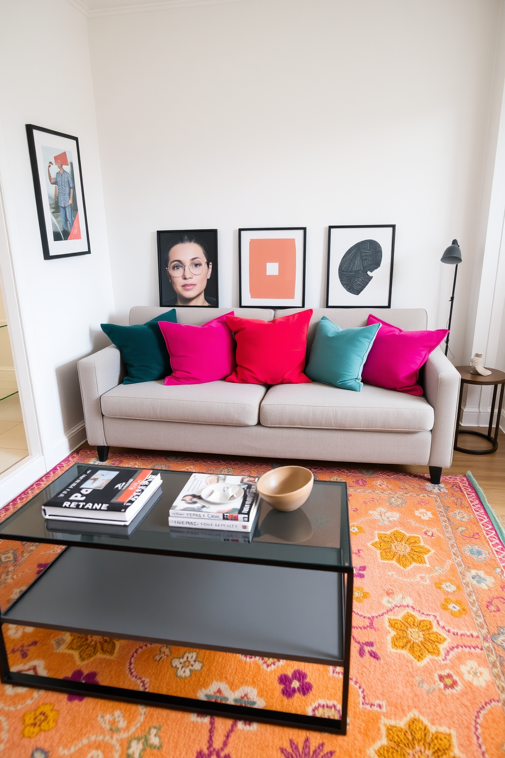 A cozy small apartment living room featuring a comfortable sofa in a neutral tone. Brightly colored throw pillows and a vibrant area rug add a pop of color to the space. A sleek coffee table sits in front of the sofa, adorned with a few stylish books and a decorative bowl. The walls are painted in a soft white, enhancing the room's brightness and openness.