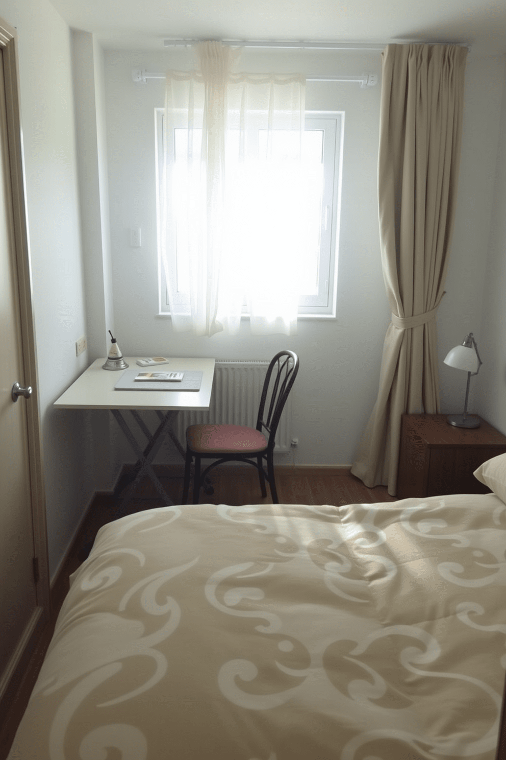 A small bedroom featuring a foldable table that serves as both a workspace and dining area. The walls are painted in a soft pastel color, and a cozy bed with plush bedding occupies one side of the room. A stylish chair is placed next to the foldable table, creating an inviting nook for reading or working. Natural light streams in through a window adorned with sheer curtains, enhancing the room's airy feel.