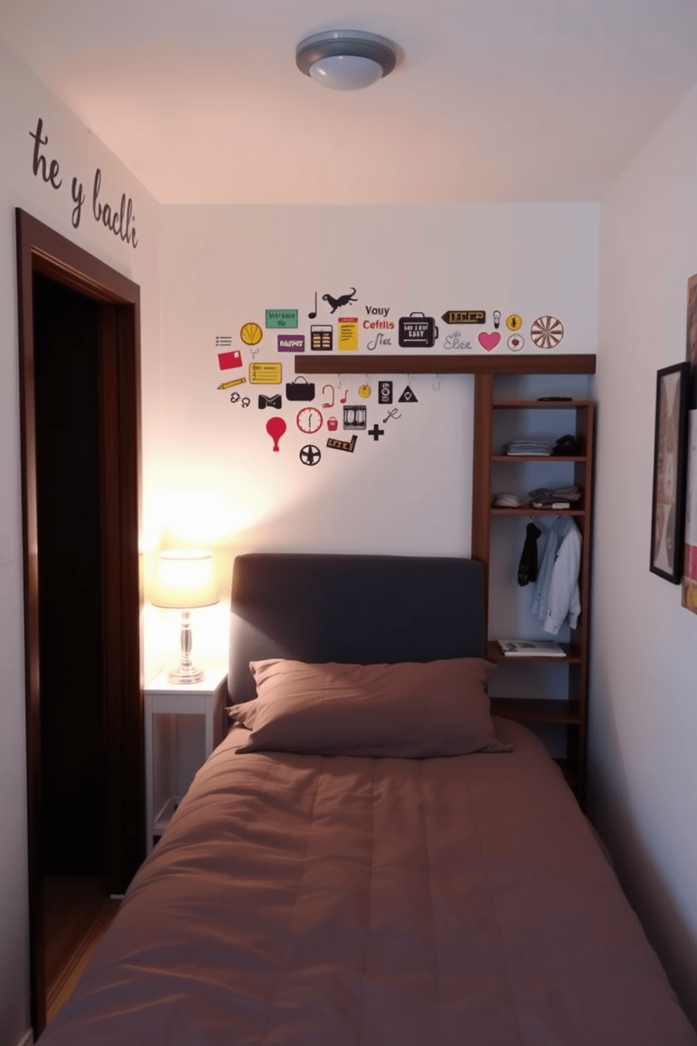 A cozy small bedroom featuring wall decals that reflect personal interests and style. The bed is positioned against a light-colored wall, with a colorful array of decals adding character above the headboard. The closet is designed with sliding doors to maximize space, incorporating shelves and hooks for organization. Soft lighting from a bedside lamp enhances the inviting atmosphere, creating a perfect retreat.