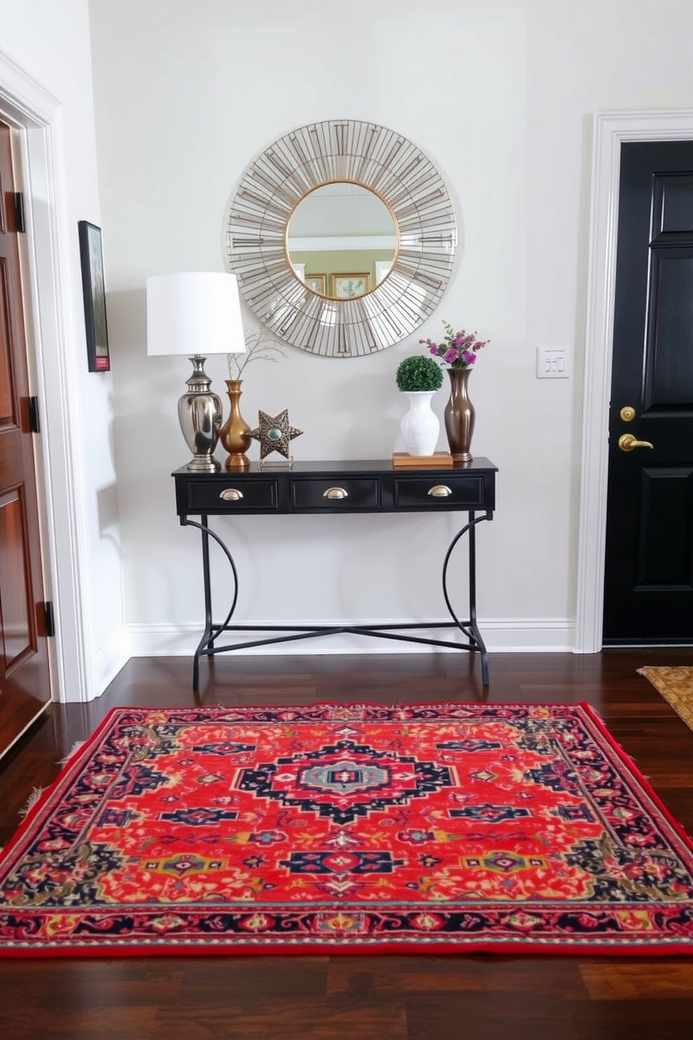 A colorful rug lies at the center of the entryway, adding warmth and personality to the space. Surrounding the rug, a small console table is adorned with decorative items and a stylish mirror above it, enhancing the welcoming atmosphere.