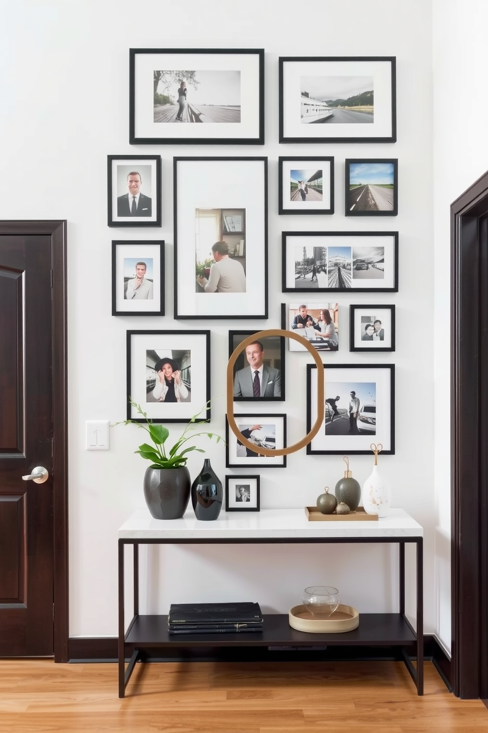 Create a gallery wall featuring a curated collection of framed photographs in various sizes. The wall is painted in a soft neutral tone to enhance the visual impact of the artwork. Design a small foyer that combines functionality and style. Incorporate a sleek console table with decorative items and a stylish mirror to create an inviting entrance.