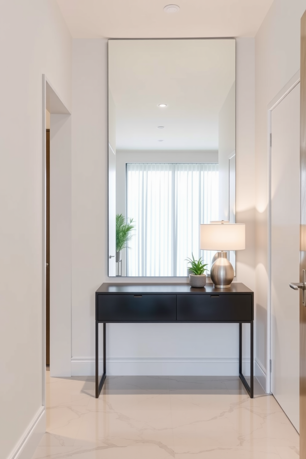 A small foyer that maximizes space and light. The design features a large mirror on the wall opposite the entrance, enhancing the brightness of the area. The floor is adorned with elegant tile that complements the overall color scheme. A sleek console table sits beneath the mirror, decorated with a stylish lamp and a small potted plant.