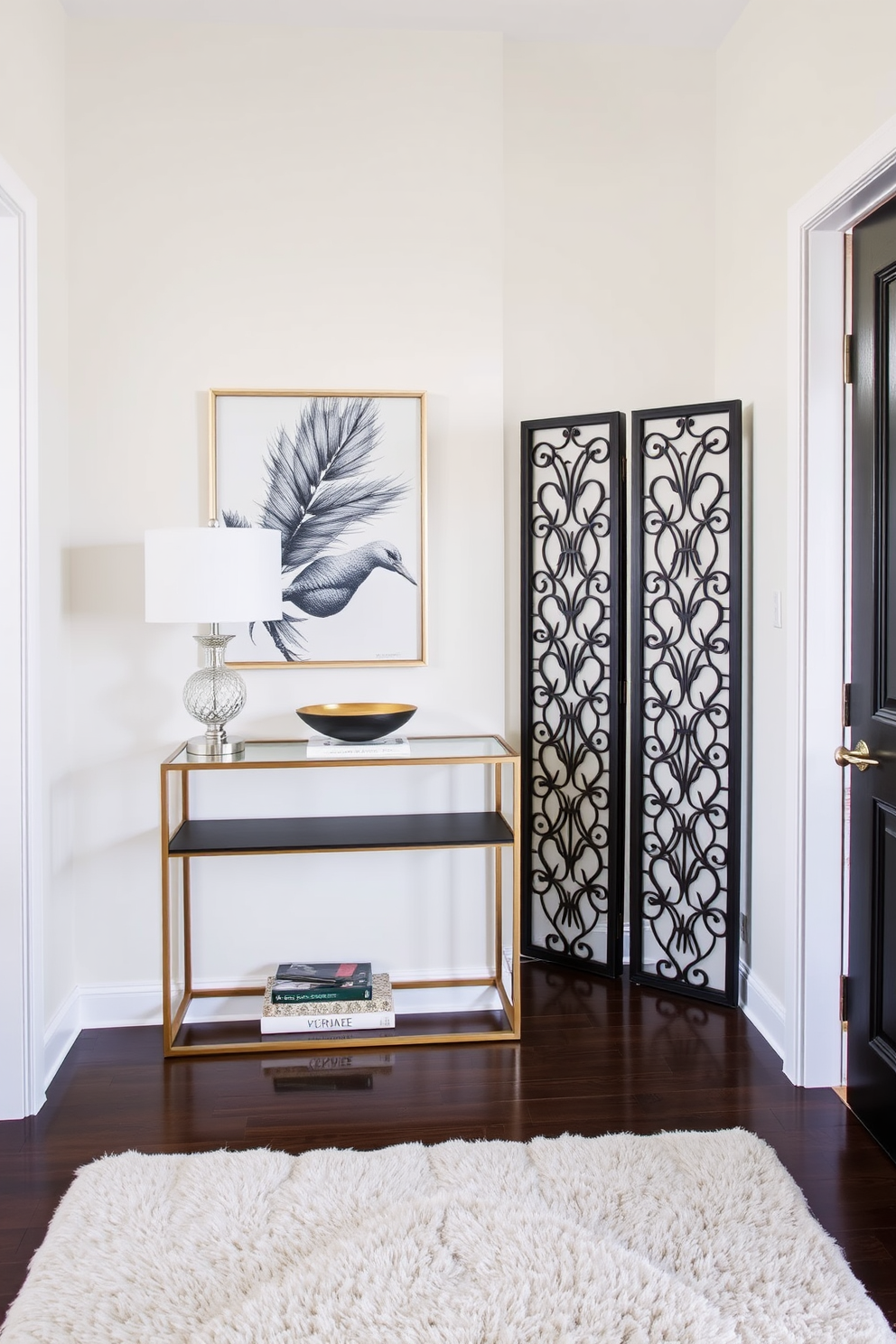 A small foyer design that combines elegance and functionality. The space features a sleek console table against the wall, adorned with a stylish lamp and a decorative bowl for keys. To the side, a decorative screen provides privacy while adding an artistic touch. The walls are painted in a soft neutral tone, and a plush area rug anchors the space, inviting guests into the home.