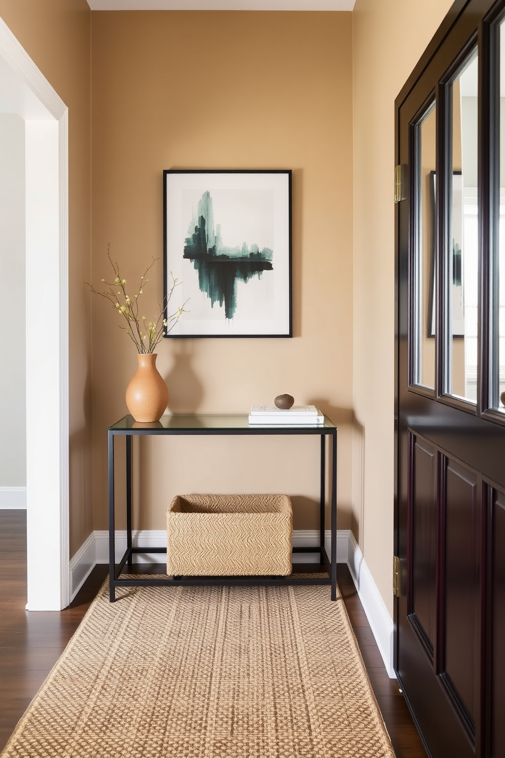 A stylish foyer featuring a sleek console table with a decorative vase and a statement art piece above it. The walls are painted in a warm neutral tone, and a woven rug adds texture to the space while a stylish mirror reflects light.