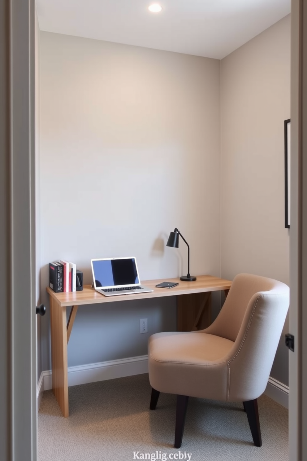 A small home office features a foldable desk that can be easily tucked away when not in use, providing flexibility in the space. The walls are painted in a soft gray, and a cozy armchair sits in the corner, creating a comfortable reading nook.