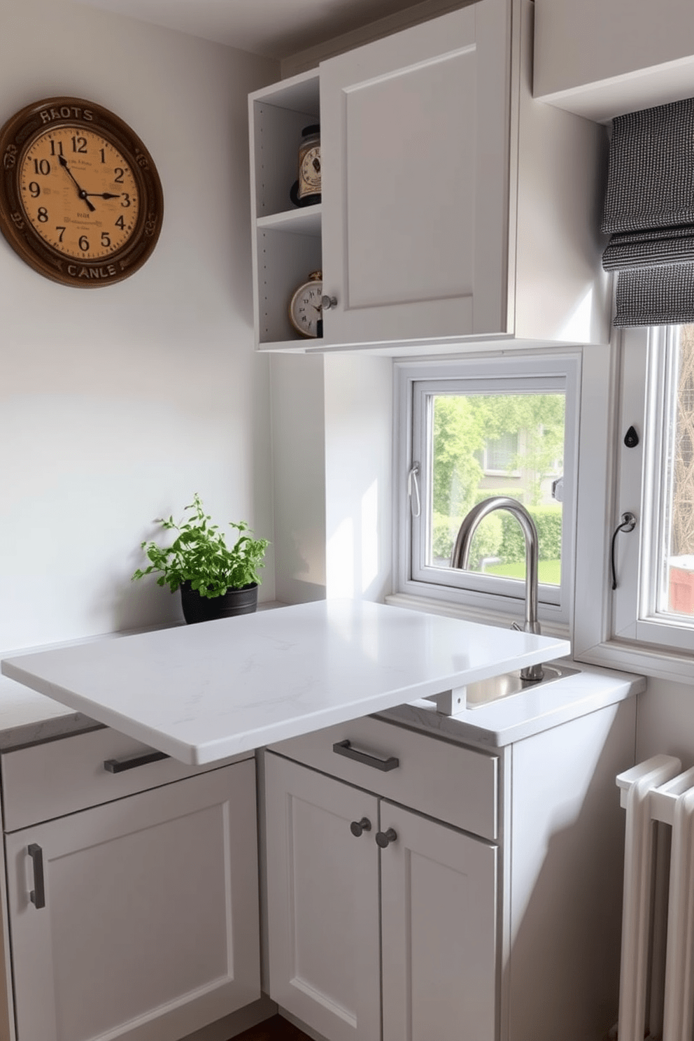 A cozy small kitchen featuring a fold-down table for dining. The table is mounted on the wall and can be easily folded down when needed, creating a space-efficient solution for meals. The kitchen cabinets are in a soft white finish, complemented by a sleek countertop made of quartz. A small herb garden sits on the windowsill, adding a touch of greenery and freshness to the space.