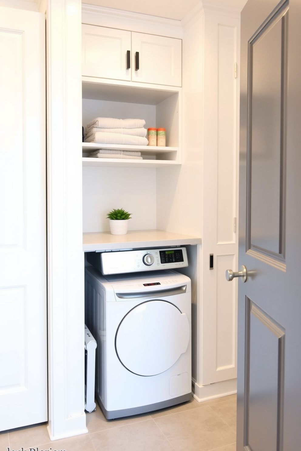 A small laundry room featuring a clever mini laundry chute design that seamlessly integrates into the cabinetry. The room has bright white walls and a light gray tiled floor, with a compact washer and dryer set tucked beneath a countertop for folding clothes. A built-in shelf above the appliances holds neatly stacked towels and laundry supplies, while a small potted plant adds a touch of greenery. The mini laundry chute is discreetly placed in the corner, allowing for easy access and efficient laundry management.