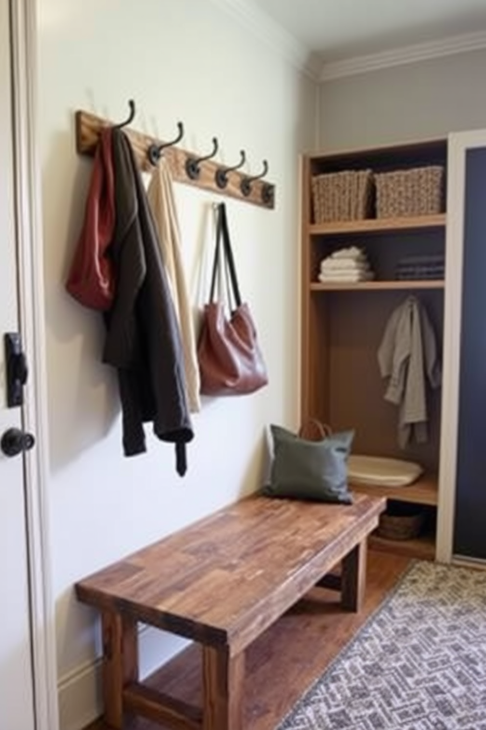 A cozy mudroom featuring wall hooks for easy access to coats and bags. The space is adorned with a bench made of reclaimed wood, providing a rustic charm and practicality.