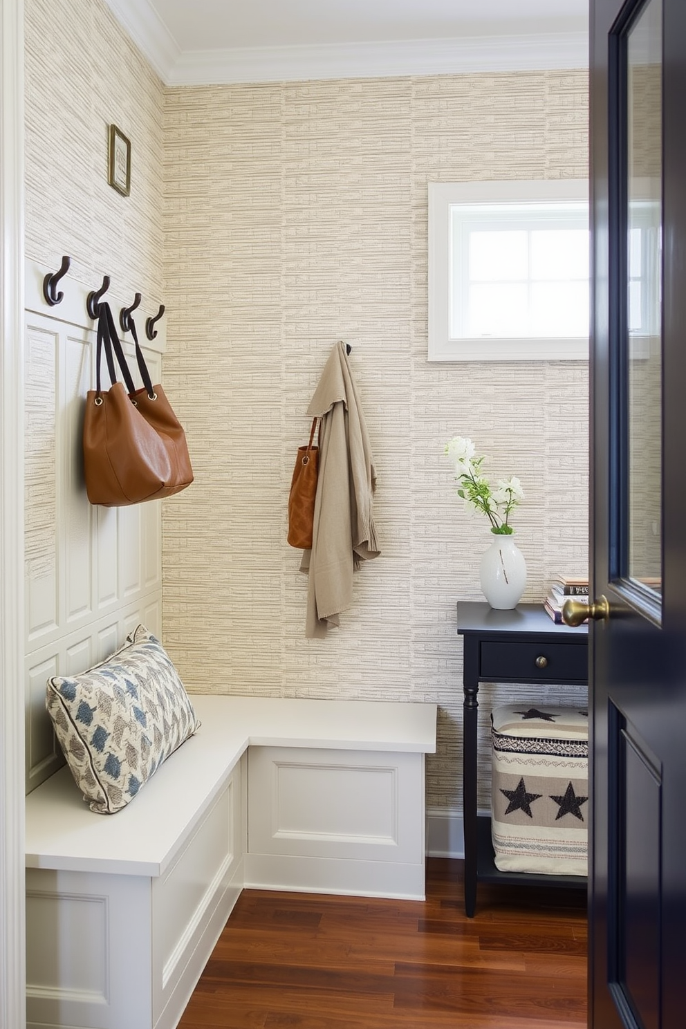 Textured wallpaper adds depth and character to a small mudroom, creating a welcoming atmosphere. Consider a design with a subtle pattern in neutral tones to enhance the space without overwhelming it. Incorporate functional storage solutions such as built-in benches and hooks for coats and bags. A small console table can provide additional space for keys and everyday items, keeping the area organized and stylish.