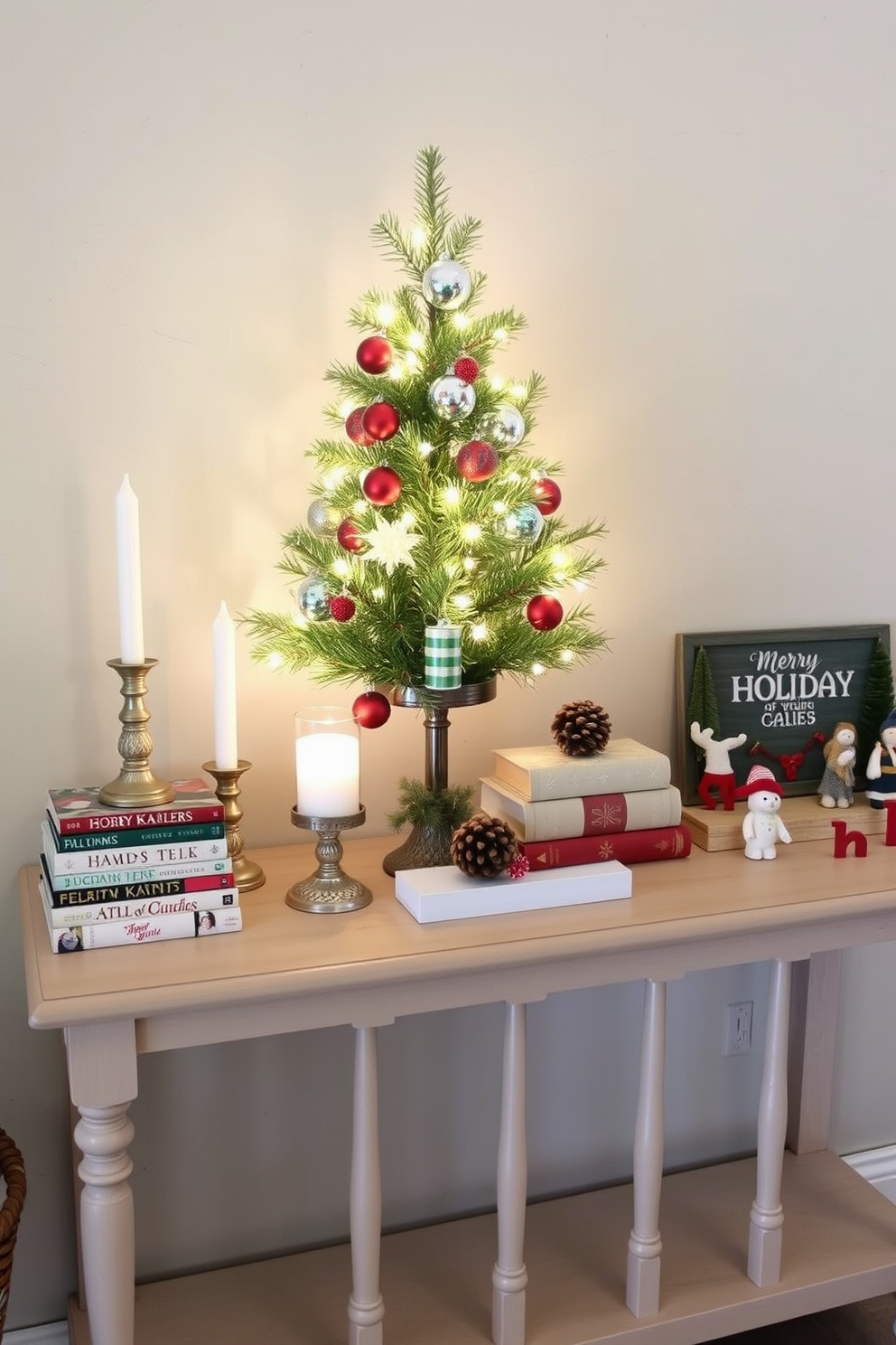 Create a cozy holiday vignette on a console table featuring a mix of festive decorations. Include a small evergreen tree adorned with twinkling lights and colorful ornaments, flanked by decorative candles in varying heights. Add a collection of holiday-themed books stacked on one side, topped with a small pinecone arrangement. On the other side, place a charming holiday sign and a few seasonal figurines to enhance the festive spirit.