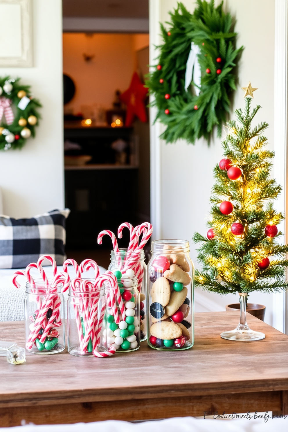 Create a cozy holiday scene in a small living area. Use clear glass jars filled with an assortment of colorful holiday treats like candy canes, chocolates, and cookies, arranged on a rustic wooden table. Incorporate festive decorations that maximize the space. Hang a small wreath on the wall and place a miniature Christmas tree in the corner, adorned with twinkling lights and ornaments.