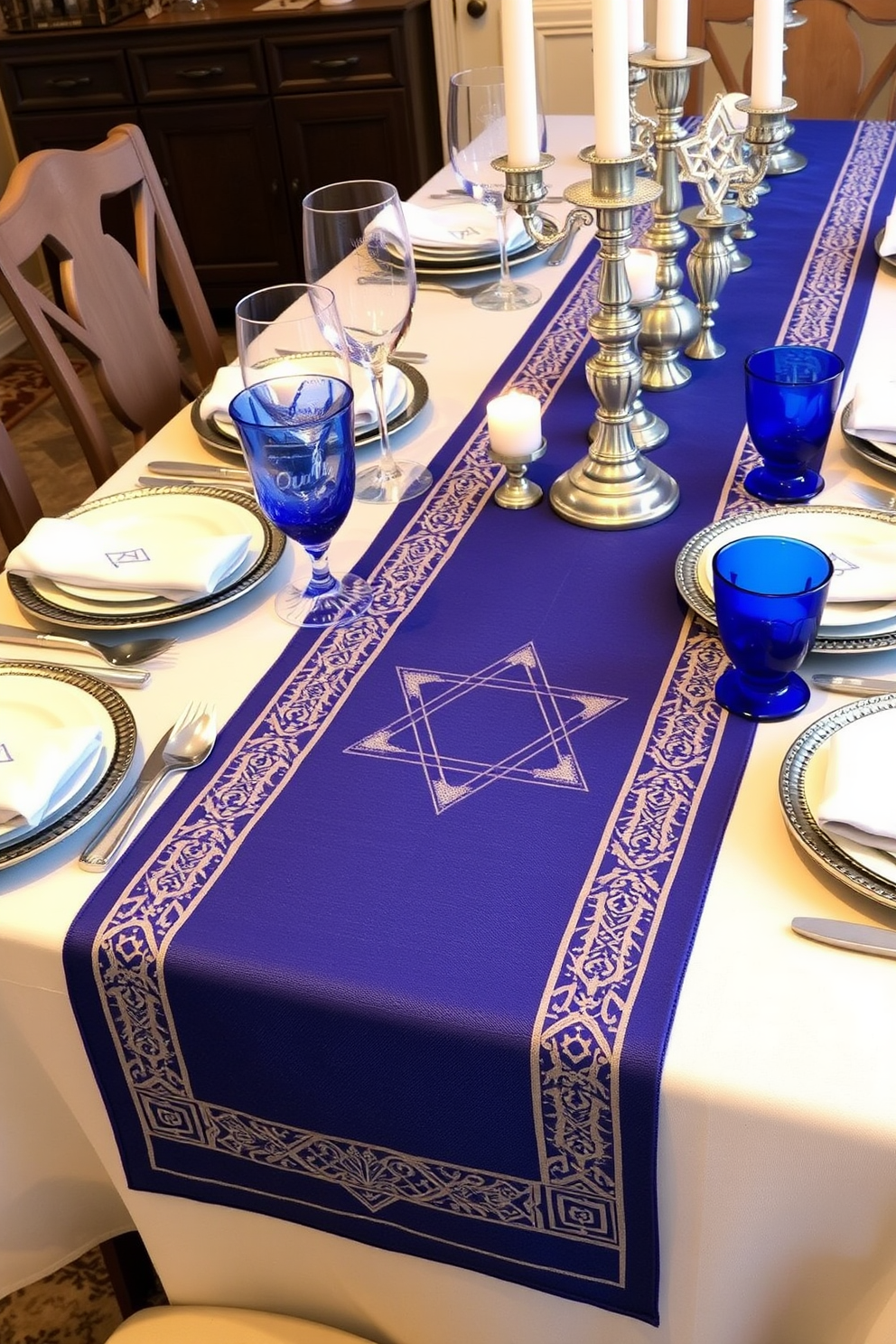 A beautifully set dining table featuring a table runner adorned with the Star of David. The runner is complemented by elegant blue and silver tableware, creating a festive atmosphere for Hanukkah celebrations.