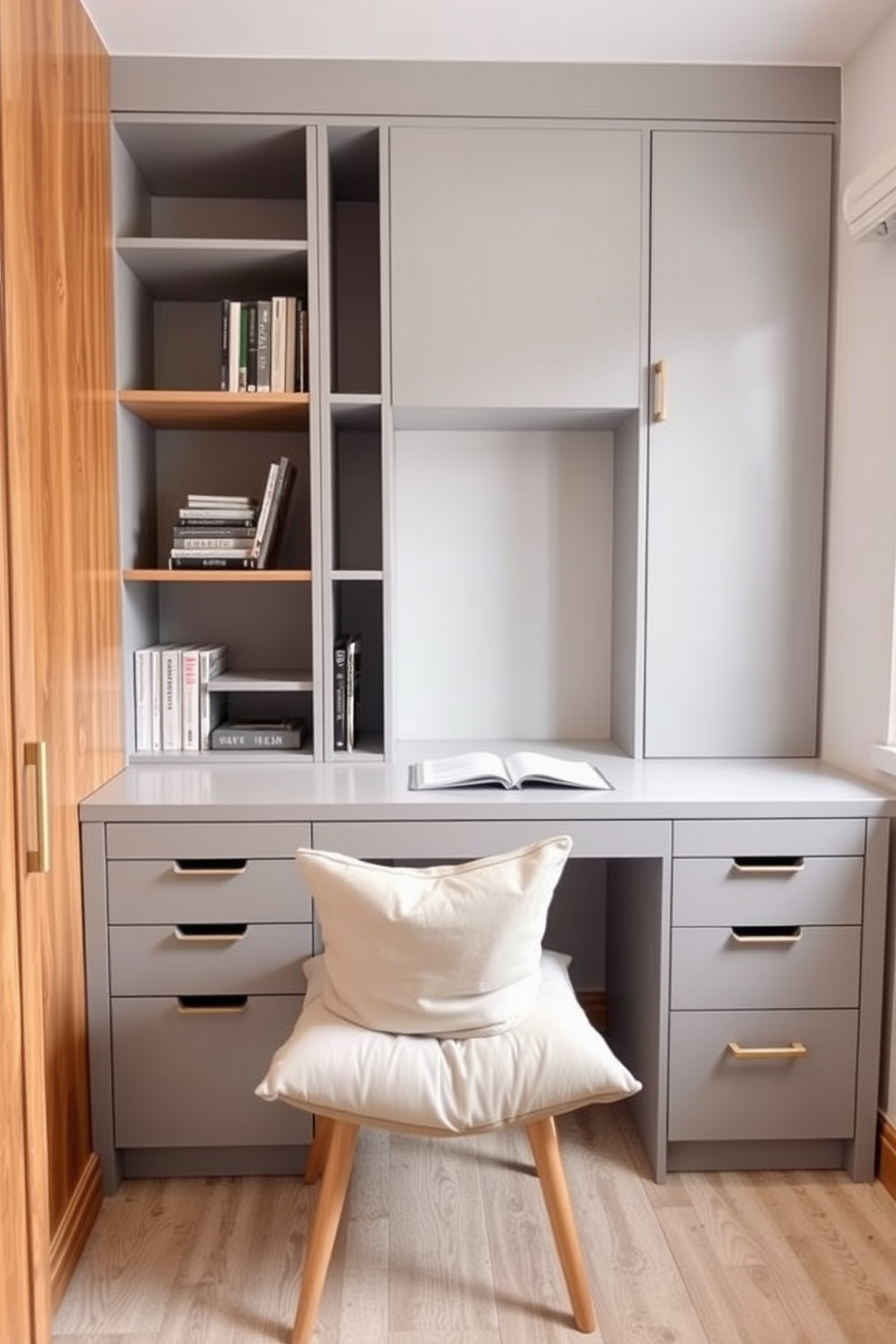 A small study room features under-desk storage that keeps the space organized and clutter-free. The desk is positioned against the wall, with sleek drawers and shelves integrated into the design for easy access to books and supplies. The color scheme is a calming light gray, complemented by warm wooden accents. A cozy chair with soft cushions sits beneath the desk, inviting you to sit down and focus on your work.