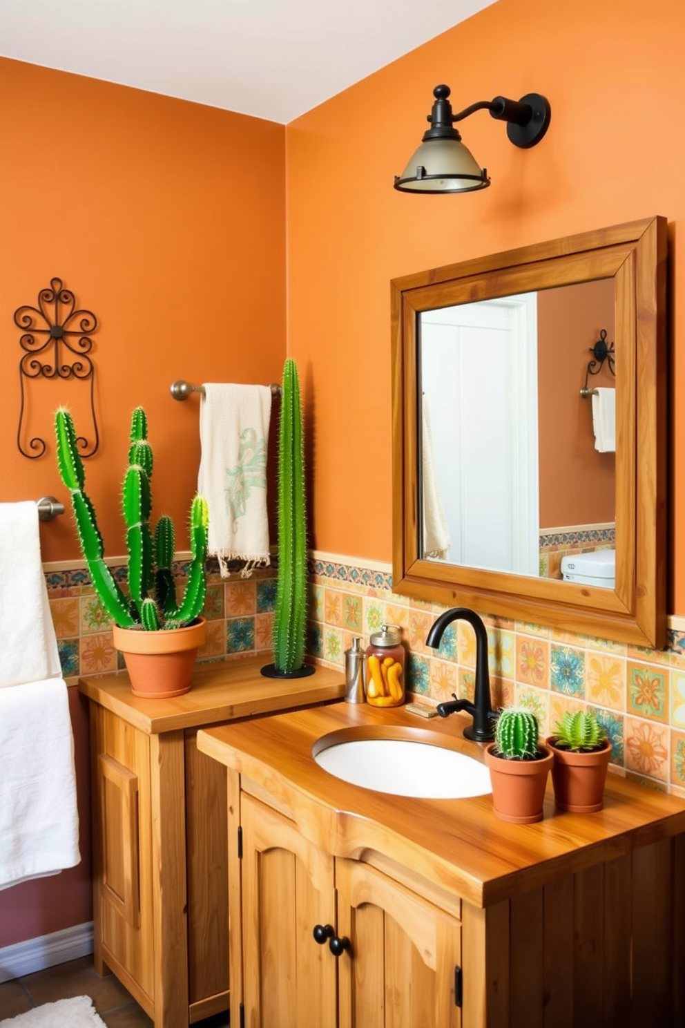 A charming Southwestern bathroom featuring decorative wrought iron towel racks that add a rustic touch. The walls are adorned with warm earth tones, and colorful ceramic tiles create a vibrant backsplash behind the sink. The space includes a freestanding wooden vanity with a natural finish and a large mirror framed in distressed wood. Cacti and succulents in terracotta pots provide a lively contrast against the soft lighting and textured textiles.