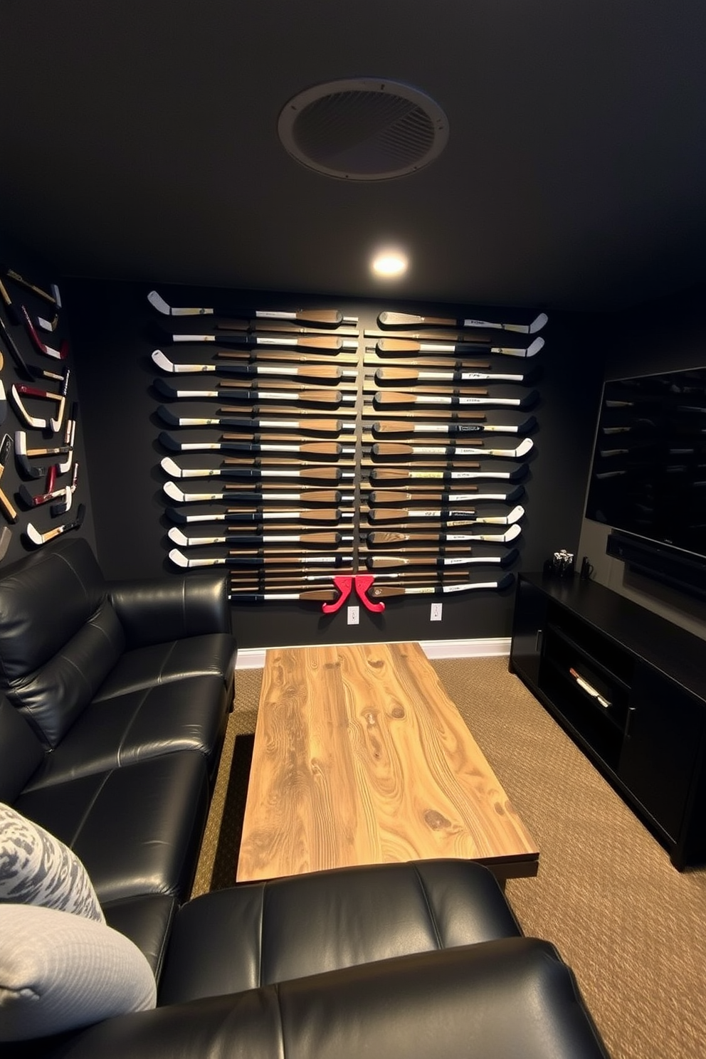 A dynamic sports man cave featuring a wall adorned with hockey stick art arranged in a creative pattern. The space includes a comfortable sectional sofa in dark leather, a large flat-screen TV mounted on the wall, and a rustic wooden coffee table in the center.