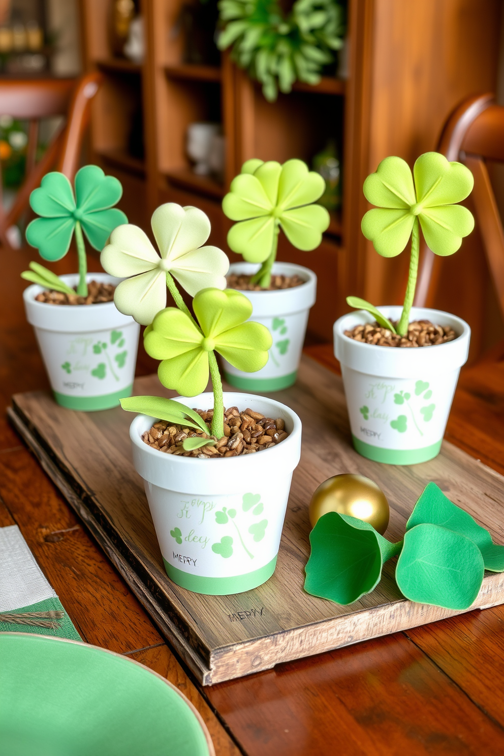 Decorative clover plants in pots are arranged on a rustic wooden table, each pot featuring intricate designs that celebrate St. Patrick's Day. Soft green and gold accents are incorporated throughout the setting, creating a festive atmosphere that invites warmth and charm.