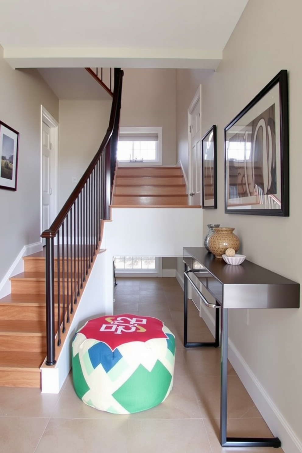 A stylish staircase landing features a colorful pouf for seating, adding a vibrant touch to the space. The walls are adorned with framed artwork, and a sleek console table rests against one side, offering both function and aesthetic appeal.