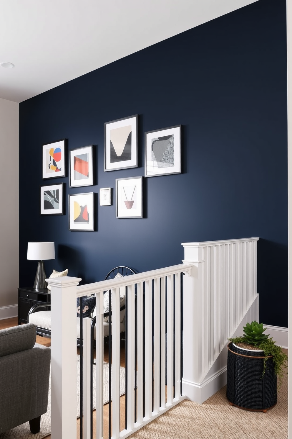 A striking accent wall painted in a deep navy blue creates a dramatic focal point in the living room. The wall is adorned with a collection of framed art pieces showcasing abstract designs in contrasting colors. The staircase features a unique wall design with vertical wooden slats painted in a soft white hue. This modern approach adds texture and visual interest while allowing light to flow through the space.