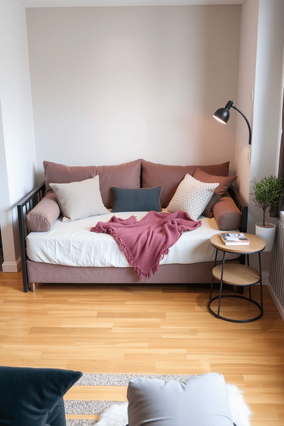 A stylish studio apartment featuring a versatile daybed that serves as both a seating area and a sleeping space. The daybed is adorned with plush cushions and a soft throw, positioned against a backdrop of a light-colored accent wall. Adjacent to the daybed, a compact coffee table complements the seating arrangement, creating an inviting nook for relaxation. The flooring is a warm wood finish, enhancing the cozy atmosphere of the studio while allowing for easy movement throughout the space.