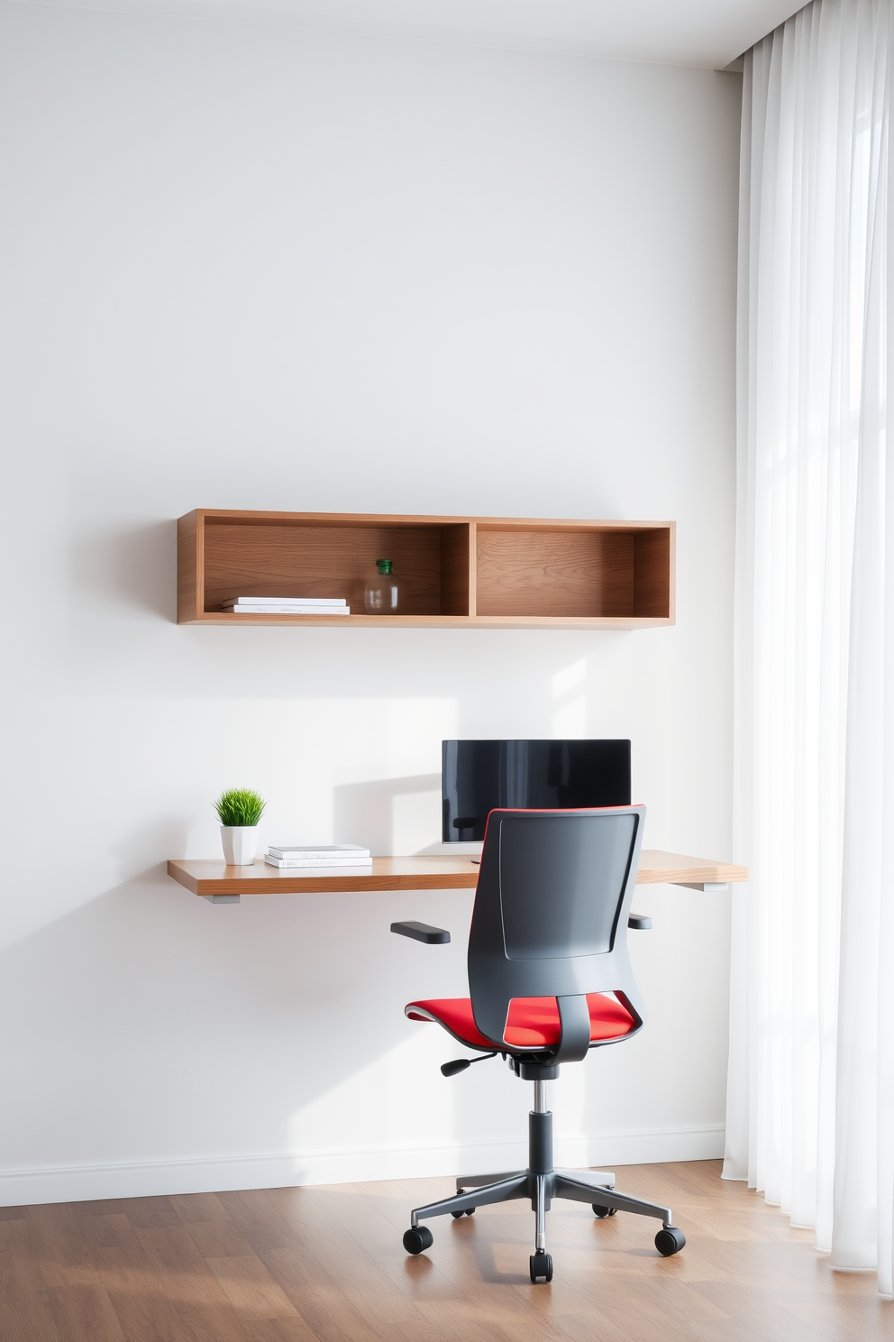 A modern study room featuring a sleek floating desk mounted against a light gray wall. The desk is minimalist with clean lines and a polished wood finish, complemented by a stylish ergonomic chair in a vibrant color. On the desk, a large monitor sits next to a small potted plant and a stack of neatly arranged books. The room is illuminated by natural light streaming through a nearby window adorned with sheer white curtains.