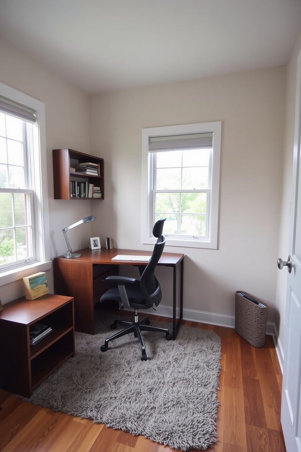 A cozy study room featuring a small bookshelf against the wall for easy access to books and materials. The room is adorned with a sleek wooden desk positioned near a window, allowing natural light to illuminate the space. A comfortable ergonomic chair sits at the desk, complemented by a stylish desk lamp. The walls are painted in a soft neutral tone, and a plush area rug adds warmth to the hardwood floor.