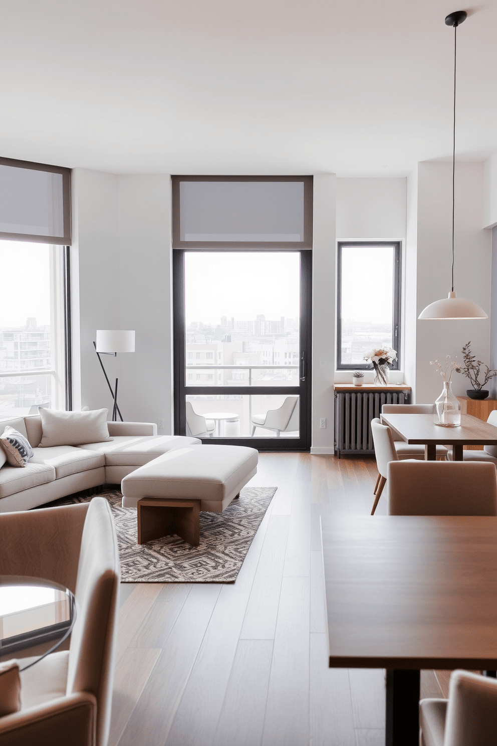 A stylish apartment design featuring sleek furniture for a modern appeal. The living area showcases a low-profile sectional sofa in a neutral color paired with a glass coffee table and minimalist accent chairs. In the dining space, a contemporary wooden table is surrounded by upholstered chairs with clean lines. Large windows allow natural light to flood the room, highlighting the open layout and elegant decor.