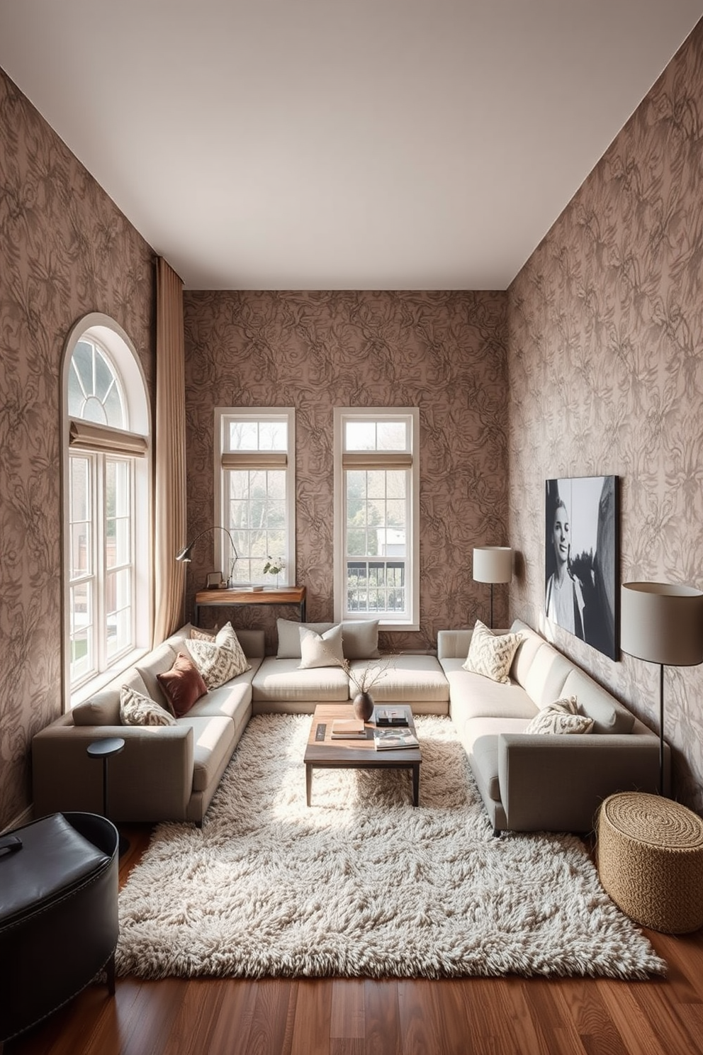 A striking accent wall features textured wallpaper that adds depth and interest to the space. The wallpaper showcases an intricate pattern in soft neutral tones, creating a warm and inviting atmosphere. The sunken living room is designed with a cozy sectional sofa that wraps around a low coffee table. Large windows allow natural light to flood in, highlighting the plush area rug that anchors the seating area.