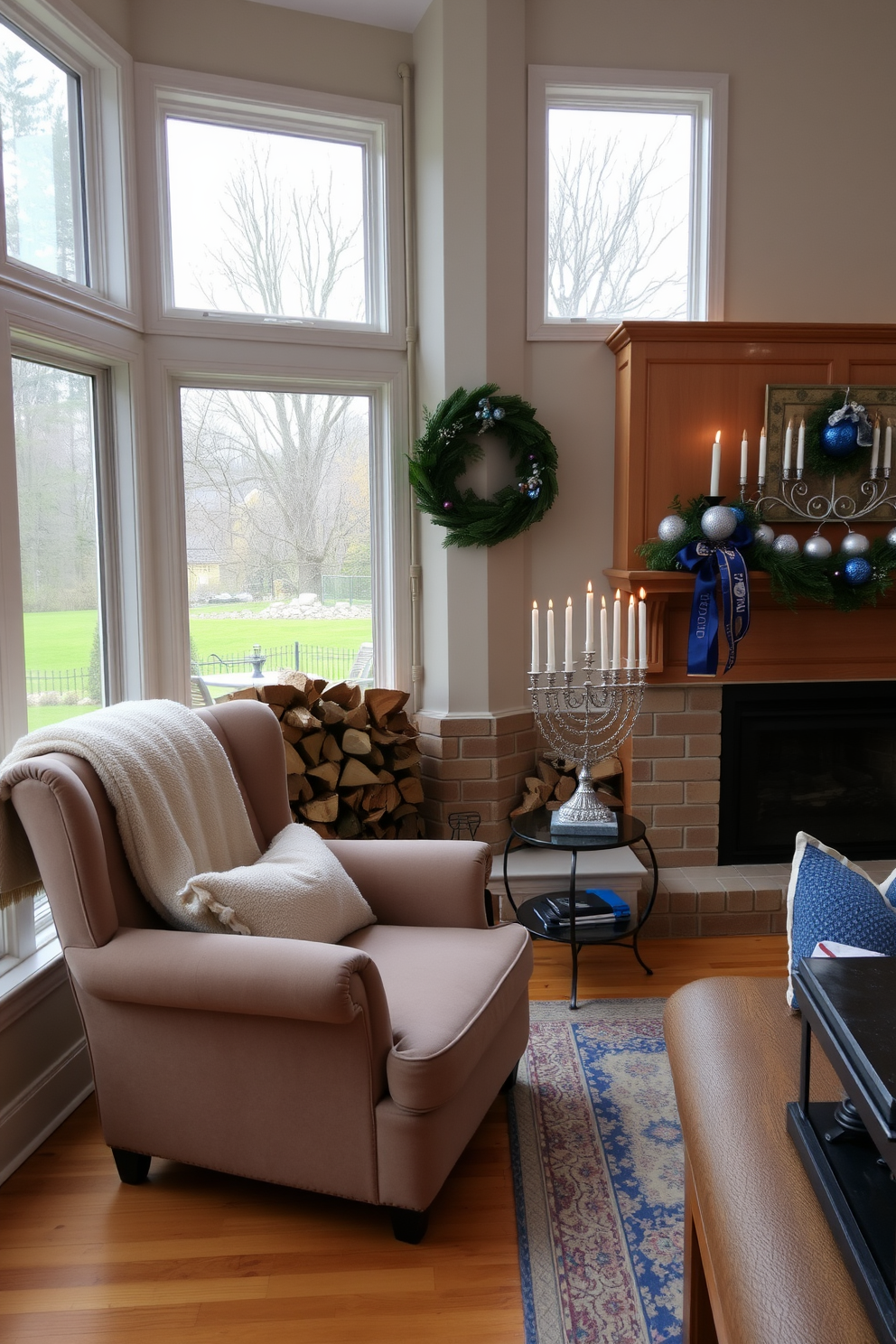 A cozy fireplace corner features a plush armchair with a soft throw blanket draped over it. The fireplace is surrounded by stacked firewood and a decorative mantel adorned with festive Hanukkah decorations. In the sunroom, large windows allow natural light to flood the space, highlighting the warm tones of the wooden furniture. A beautifully arranged menorah sits on a small table, complemented by blue and silver accents throughout the room.