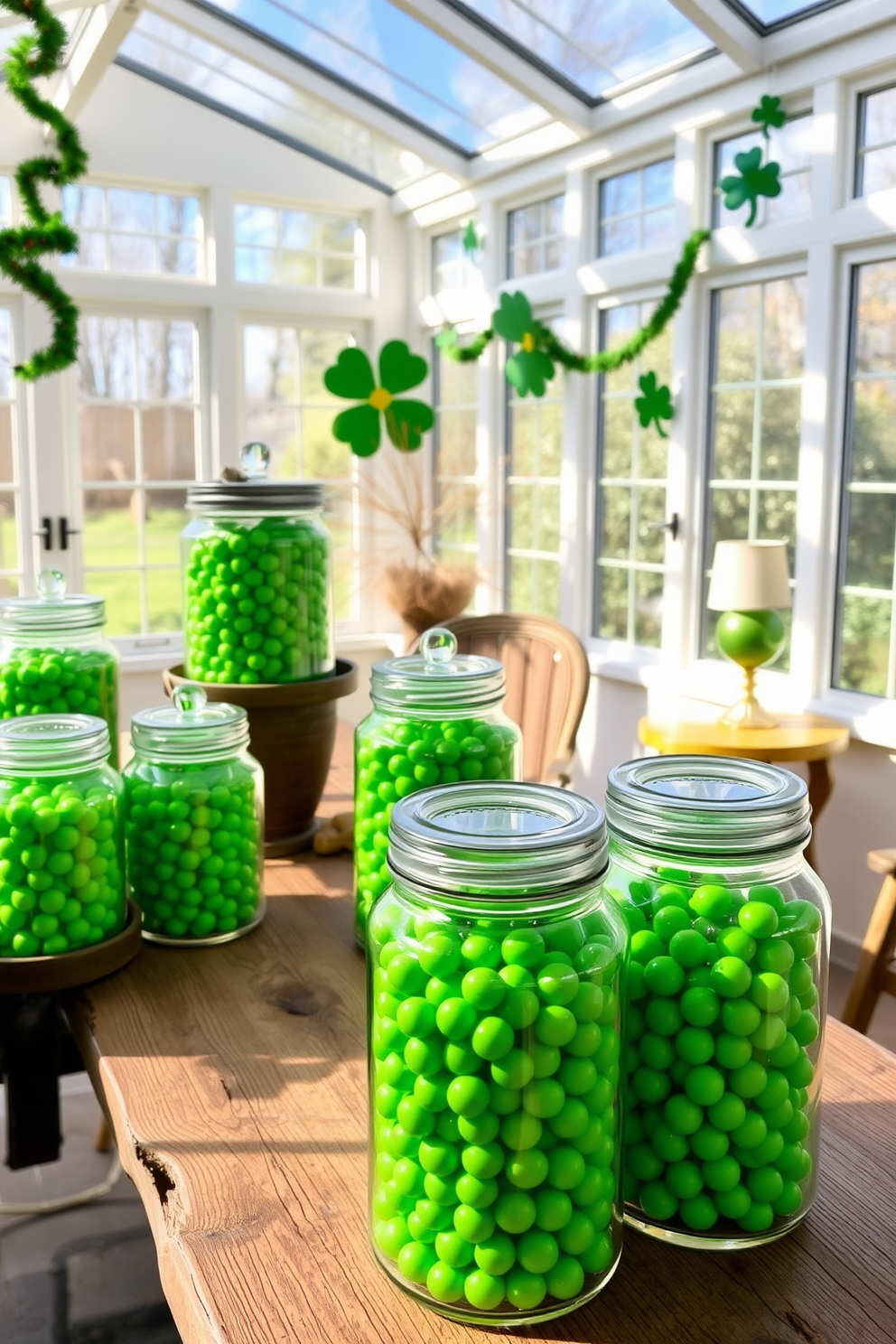 A bright sunroom filled with natural light features a collection of glass jars filled with vibrant green candies. The jars are arranged on a rustic wooden table, surrounded by festive St. Patrick's Day decorations like shamrock garlands and gold accents.