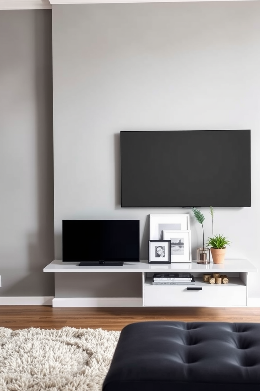 A modern living room featuring a floating TV stand with clean lines. The wall behind is painted in a soft gray, providing a sleek backdrop for the large flat-screen TV mounted above the stand. The floor is adorned with a plush area rug that adds warmth to the space. Stylish decor elements, such as framed artwork and decorative plants, are thoughtfully arranged on the TV stand.