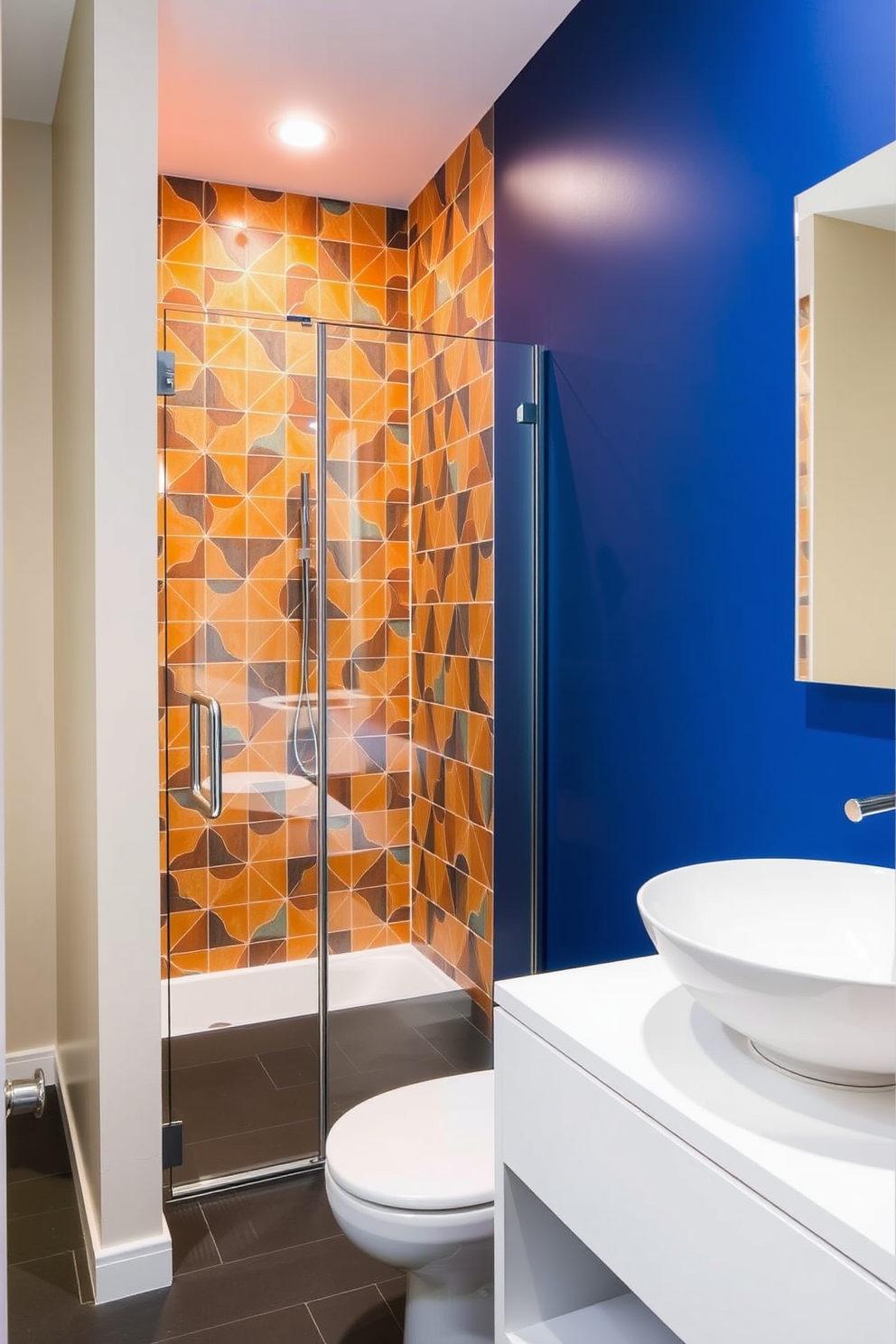 A bold accent wall features vibrant geometric tiles that create a striking focal point in the space. The remaining walls are painted in a soft neutral tone to balance the boldness of the accent. The three-quarter bathroom includes a sleek glass shower enclosure with modern fixtures. A floating vanity with an elegant vessel sink complements the contemporary design while providing ample storage.