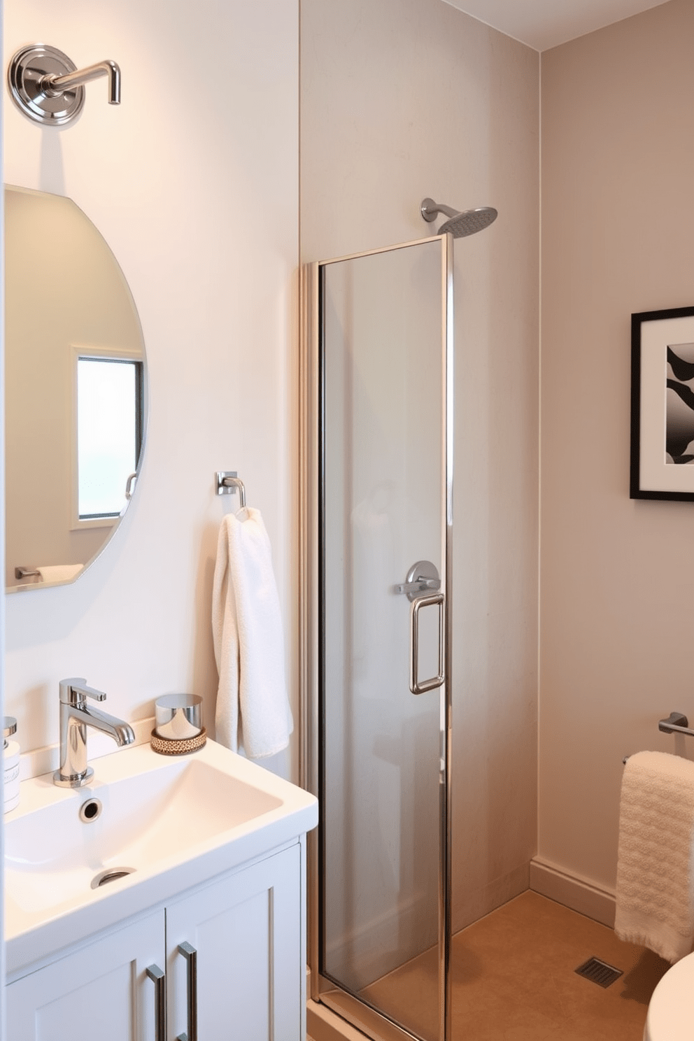 A stylish three-quarter bathroom features elegant wall-mounted faucets and fixtures that enhance the modern aesthetic. The space includes a sleek shower enclosure with a glass door and a minimalist vanity with ample storage. The color palette consists of soft neutrals and warm tones, creating a welcoming atmosphere. Decorative elements such as a framed artwork and plush towels add a touch of sophistication to the design.