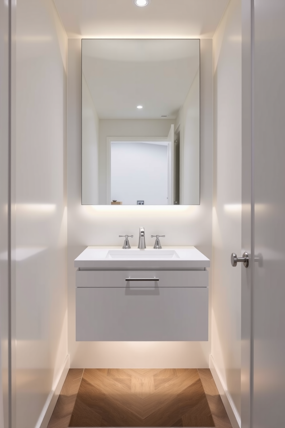 A floating vanity creates an open and airy atmosphere in a tiny powder room. The sleek design features clean lines and minimalistic hardware, enhancing the sense of space. Soft ambient lighting illuminates the room, highlighting the vanity's unique features. A large mirror above the vanity reflects light and visually expands the area, making it feel more inviting.