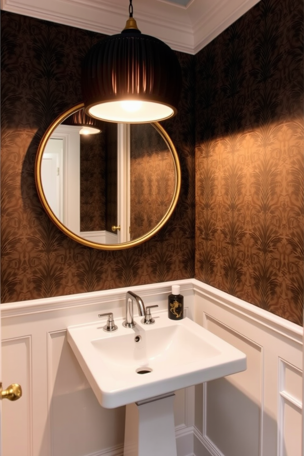 A chic tiny powder room features a sleek pedestal sink with a modern faucet. Above the sink, a stunning statement light fixture hangs, casting a warm glow across the space. The walls are adorned with a bold wallpaper pattern that adds depth and character. A round mirror with a decorative frame complements the sink, creating an inviting atmosphere.